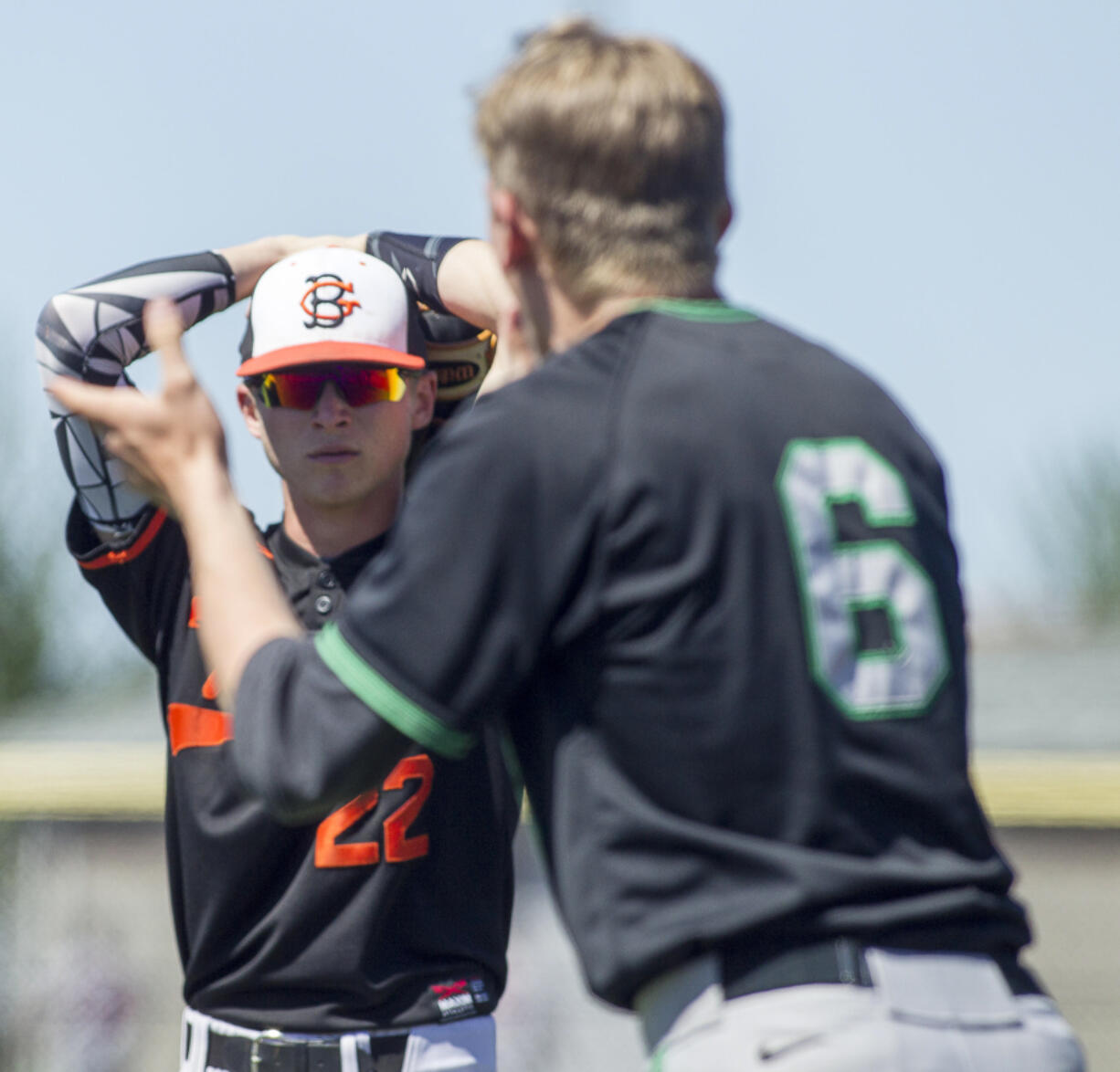 While departing the field Battleground shortstop Austin Adams looks at celebrating Kentwood's Josh Davis during The 2017 WIAA 4A State Baseball Tournament at Foss High School on May 202017. Kentwood scored two runs in the bottom of the 7th Inning to edge out Battleground 3-2.