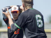 While departing the field Battleground shortstop Austin Adams looks at celebrating Kentwood's Josh Davis during The 2017 WIAA 4A State Baseball Tournament at Foss High School on May 202017. Kentwood scored two runs in the bottom of the 7th Inning to edge out Battleground 3-2.