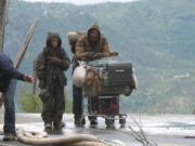 Stars Kodi Smit-McPhee, left, and Viggo Mortensen prepare to film a scene for “The Road” in a 2008 photo taken by Rod Ludvigsen in the Mount St. Helens National Volcanic Monument.