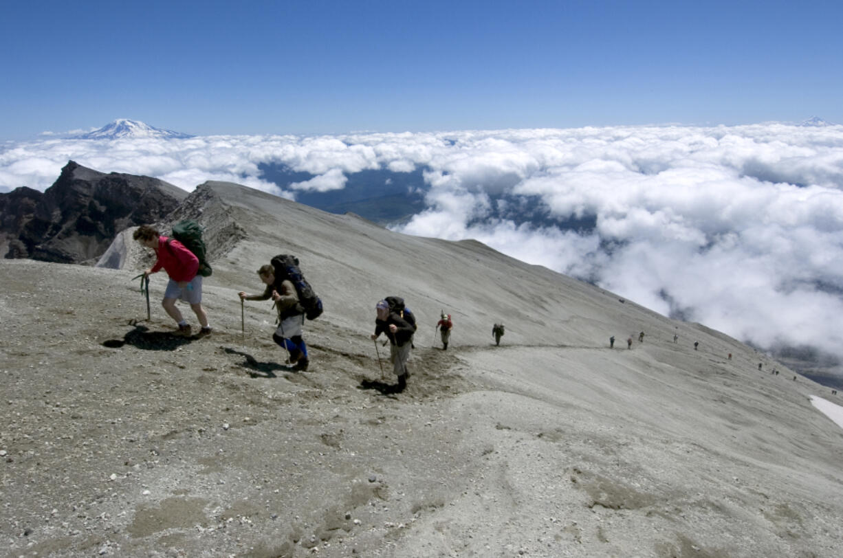 Climbers reach within 25 feet of the 8,363-foot summit on Mount St. Helens in 2006. Permits to climb the destination are sold out for the summer.