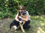 The author with Queequeg, her German shepherd being trained as a service dog.