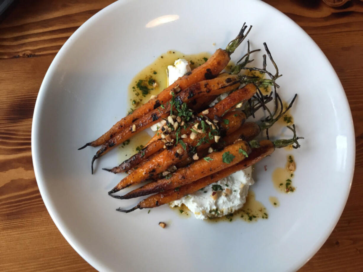 The recently opened Mount Tabor Brewing and Pub features a selection of beers, roasted carrots with hazelnuts and ch?vre, a wood fired pretzel, and  house-made sausage plate.