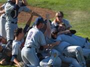 The King's Way Christian baseball team celebrates after winning the Class 1A state title with a 5-3 victory over Cedar Park Christian on Saturday in Yakima (Ken Waz/for The Columbian)