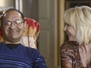 Akhil Jhaveri, 51, left, smiles as his wife, Laura Jhaveri, 51, tells him a story at their home in Ridgefield, Tuesday March 21, 2017. Akhil was diagnosed with ALS, or Lou Gehrigs disease, in July 2011, and has since lost the ability to move his limbs, speak and has difficulty breathing.