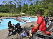 A.J. Ragsdale, right, is in his sixth year as a lifeguard at the pool at Alderbrook Park in Brush Prairie. The park employs between 20 to 100 people, depending on its event schedule, according to event specialist Chris Bryden.