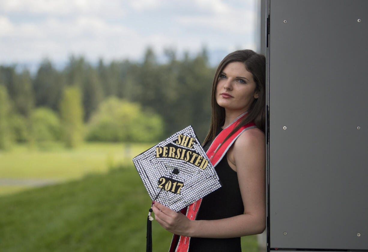 Skye Troy, 22, will graduate with a bachelor&#039;s in public affairs from Washington State University Vancouver today. Troy, pictured on campus Thursday, overcame drug addiction and poverty as a child in Oklahoma to receive her degree.