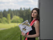 Skye Troy, 22, will graduate with a bachelor&#039;s in public affairs from Washington State University Vancouver today. Troy, pictured on campus Thursday, overcame drug addiction and poverty as a child in Oklahoma to receive her degree.