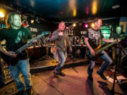 Guitarist Robert Anthony Robinson, from left, singer Todd Freund, bassist Erin Bartley and keyboardist Rich Petko of The Strange.