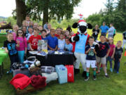 Bennington: Evan Yost, in Seahawks jersey, celebrated his eighth birthday with 35 friends, but instead of gifts, he asked everyone to bring towels, socks and blankets to be donated to the Portland Rescue Mission.