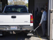 Gabriel Engel tests the emissions of a diesel truck at the Washington State Emission Inspection Station in Vancouver. The Salmon Creek site is scheduled to close in early June. All vehicle smog testing will be done in east Vancouver.