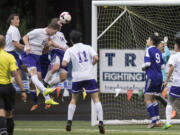 Columbia Riverís Ryan Connop (23), heads the ball into the goal in what was initially thought to be the fourth goal for Columbia River during overtime in the first round of the 2A state playoffs against Highline at the Kiggins Bowl in Vancouver, Tuesday May 16, 2017.