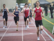 Ariane Kunze/The Columbian
Camas’ Daniel Maton, right, crosses the finish line coming in first in the 4A boys 800 meters in a time of 1:53.87.