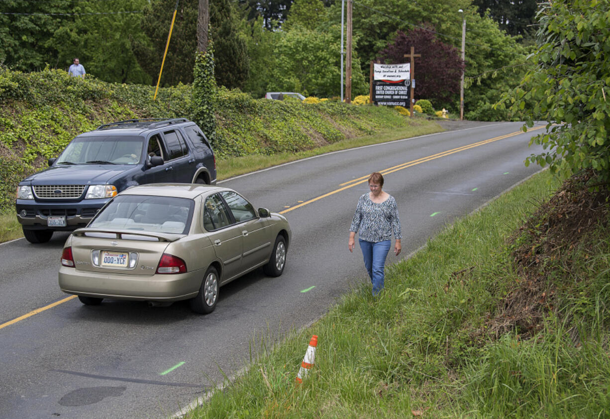 Vancouver resident Sharon Kenoski walks along a stretch of Northeast 68th Street, where residents have been trying to get sidewalks for decades. The project is now at the top of the county’s Sidewalk Infill Priority List, and the county applied for an $800,000 grant, which would fund less than half of the $2.1 million project.