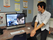 Skyview High School sophomore Jonathan Lane watches the silent film “Detention” that he produced with fellow students, senior Brendan Nash and sophomore Seth Yoshinobu.