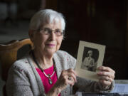 Elaine Fletcher with a portrait of her as a second lieutenant in the Army Nurse Corps, taken in 1943. After the war, she had a long career in public health.