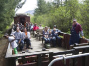 Visitors enjoy a train ride through a scenic area on the Chelatchie Prairie Railroad train in Yacolt.