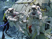 Astronauts Anne McClain, left, and Mike Barratt train for a spacewalk in NASA’s neutral buoyancy tank, which simulates zero gravity.