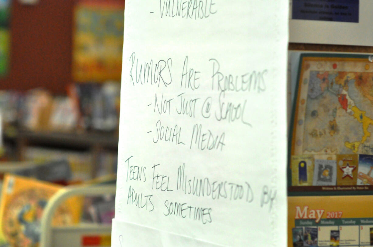 Teenage students wrote concerns about school on posters at a La Center United roundtable discussion about Netflix series &quot;13 Reasons Why&quot; at La Center Elementary School on Monday.