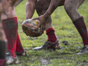 Rainy weather creates muddy conditions for players from the Clark County Chiefs and the Seattle Quake during their match at LeRoy Haagen Memorial Community Park on Saturday afternoon, March 4, 2017.