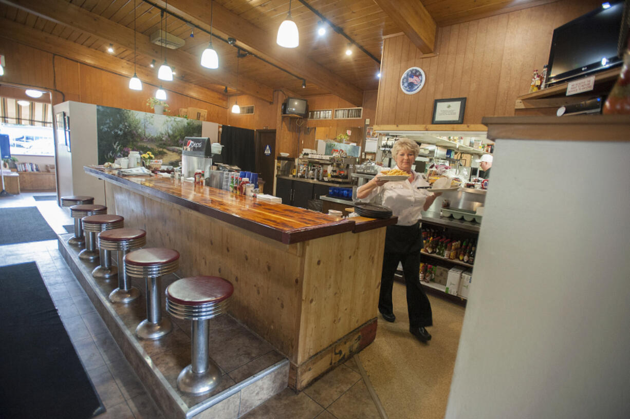 Waitress Darlene Gonzales serves up an order at Smitty's in Camas.