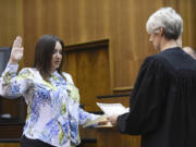 Newly appointed Clark County District Court Judge Kristen L. Parcher, left, is sworn in to the bench by District Court Judge Sonya L. Langsdorf during a ceremony Tuesday afternoon at the Clark County Courthouse. Parcher replaces District Court Judge Vernon L. Schreiber, who died April 25 at the age of 74.