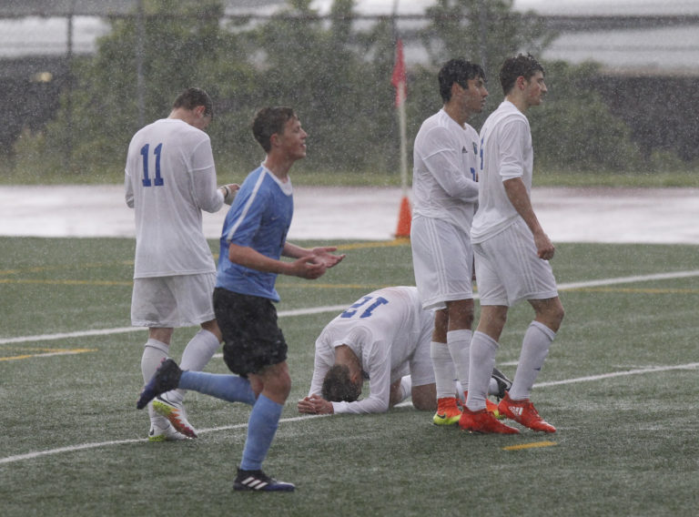 Mountain View players react to overtime loss to Gig Harbor in bi-district soccer tournament game at McKenzie Stadium.