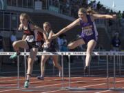 Columbia River's Ellie Walker, right, battles with Ephrata's McCall DeChenne, left, as they clear the final hurdle in the 2A Girls 100 Meter Hurdles event at the WA State Track and Field Meet Friday, May 26, 2017, in Tacoma, Wash. Walker had to settle for 2nd place finishing behind DeChenne.