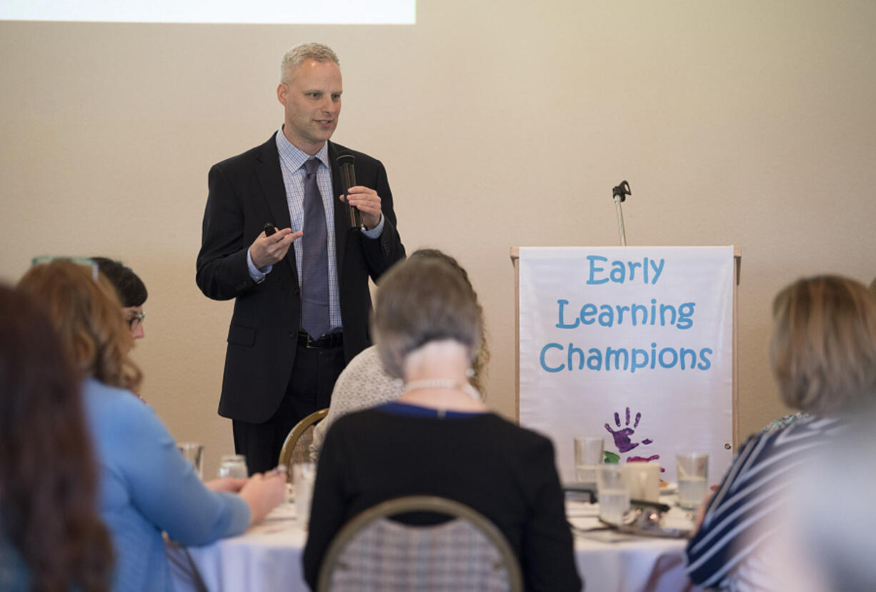 Joel Ryan, executive director of Washington State Association of Head Start and ECEAP, speaks to the crowd during the sixth annual Early Learning Champions Awards Luncheon at Club Green Meadows on Wednesday afternoon.