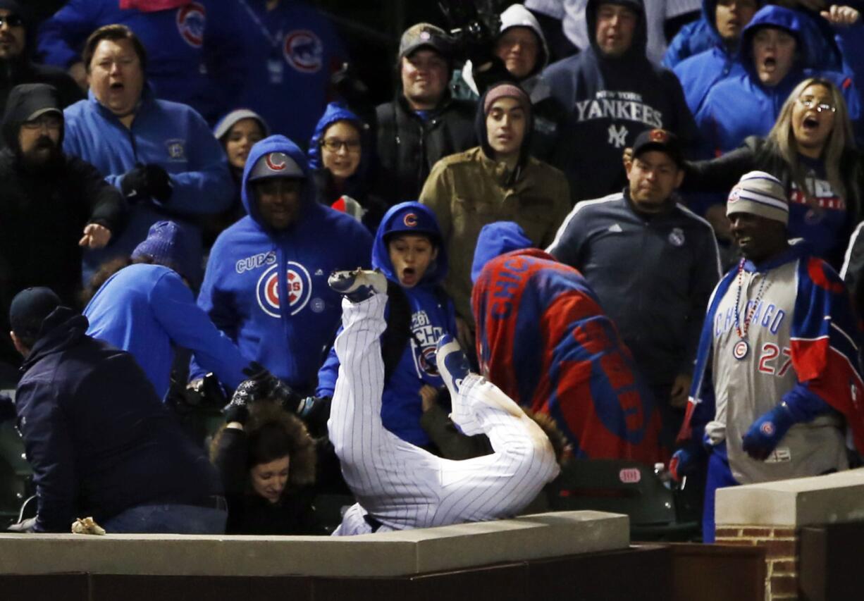 Chicago Cubs left fielder Kyle Schwarber catches a fly ball by New York Yankees' Chase Headley in foul territory during the 12th inning of an interleague baseball game Sunday, May 7, 2017 in Chicago. (AP Photo/Nam Y.