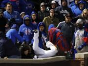 Chicago Cubs left fielder Kyle Schwarber catches a fly ball by New York Yankees' Chase Headley in foul territory during the 12th inning of an interleague baseball game Sunday, May 7, 2017 in Chicago. (AP Photo/Nam Y.