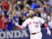 Toronto Blue Jays outfielder Kevin Pillar (11) celebrates his game winning home run against the Seattle Mariners during ninth inning American League baseball action in Toronto, Sunday, May 14, 2017.