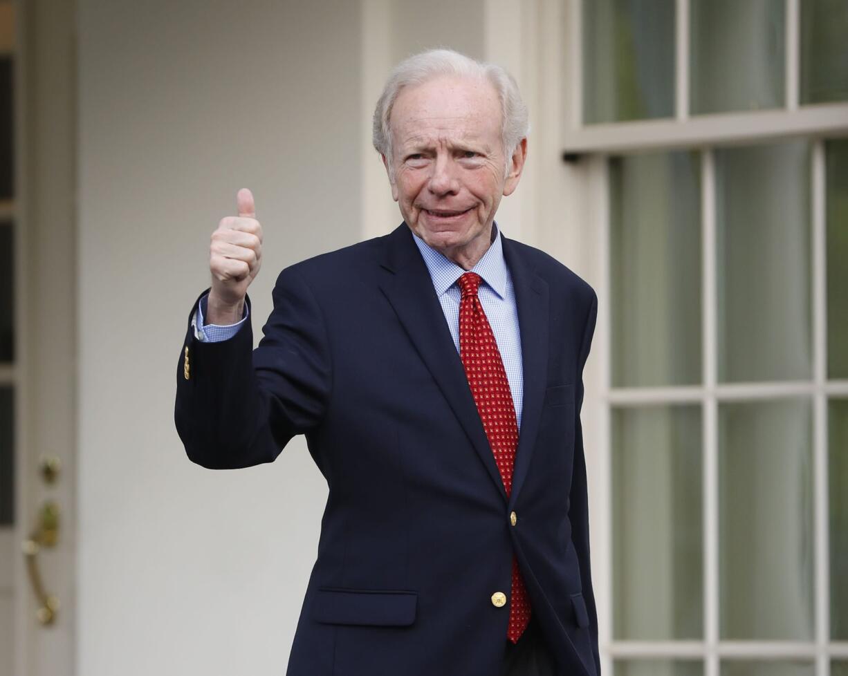 Former Connecticut Sen. Joe Lieberman gives a 'thumbs-up' as he leaves the West Wing of the White House in Washington, Wednesday, May 17, 2017. The White House says President Donald Trump will be interviewing four potential candidates to lead the FBI.