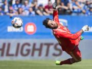 Portland Timbers' goalkeeper Jake Gleeson can't stop a goal by Montreal Impact's Kyle Fisher during the first half of an MLS soccer game in Montreal, Saturday, May 20, 2017.