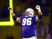 FILE - In this Dec. 16, 2000, file photo, Seattle Seahawks defensive tackle Cortez Kennedy (96) celebrates Seattle's 27-24 victory over the Oakland Raiders in an NFL football game in Seattle. The Orlando Police Department confirmed that Kennedy was found dead Tuesday, May 23, 2017, in Orlando.