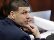 Defendant Aaron Hernandez listens during his double murder trial in Suffolk Superior Court in march in Boston. A judge is set to hear arguments in a push by lawyers for former NFL star Aaron Hernandez to erase his conviction in a 2013 murder. The former New England Patriots tight end hanged himself in his prison cell April 19 while serving a life sentence in the killing of semi-professional football player Odin Lloyd.