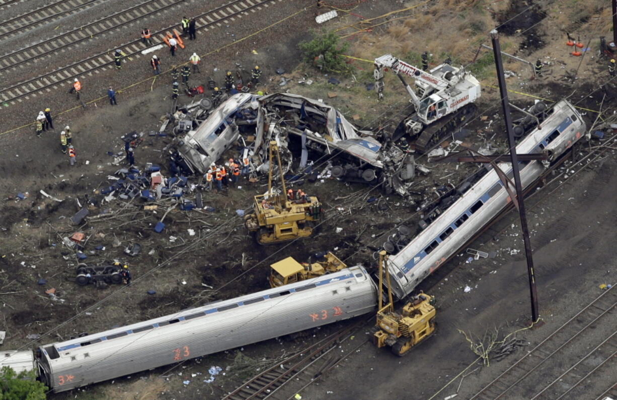 Emergency personnel work near the wreckage of a New York City-bound Amtrak passenger train following a derailment that killed eight people and injured about 200 others in Philadelphia. Amtrak engineer Brandon Bostian won&#039;t be charged in the May 12, 2015, derailment, according to two lawyers for victims of the crash, Tom Kline and Robert Mongeluzzi.