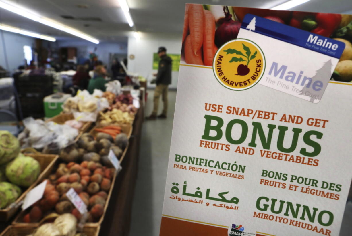 A sign advertises a program that allows food stamp recipients to use their EBT cards to shop at a farmers market in Topsham, Maine. A proposal to curtail the nation’s food stamp program would pinch families struggling to pay for groceries and ripple through other areas of the economy, including supermarkets and discounters.