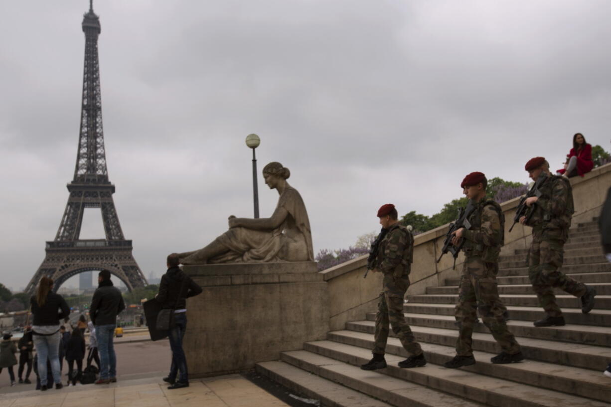 Army soldiers patrol near Trocadero plaza with the Eiffel Tower in the background in Paris, France, Saturday, May 6, 2017. Voting for France&#039;s next president starts in overseas territories and French embassies abroad, as a blackout on campaigning descends so that voters can reflect on whether to entrust their country&#039;s future to independent Emmanuel Macron or far-right populist Marine Le Pen.