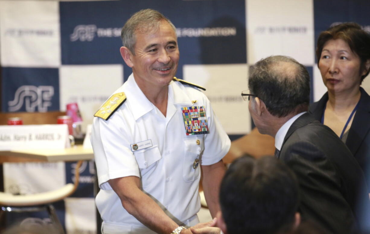 U.S. Pacific Command Commander Adm. Harry Harris Jr. shakes hands with guests after deliverinfg a speech at the Sasakawa Peace Foundation, Wednesday, May 17, 2017, in Tokyo.