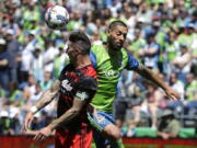 Seattle Sounders' Clint Dempsey, right, and Portland Timbers defender Liam Ridgewell, left, battle for a header in the second half of an MLS soccer match, Saturday, May 27, 2017, in Seattle. The Sounders won 1-0. (AP Photo/Ted S.