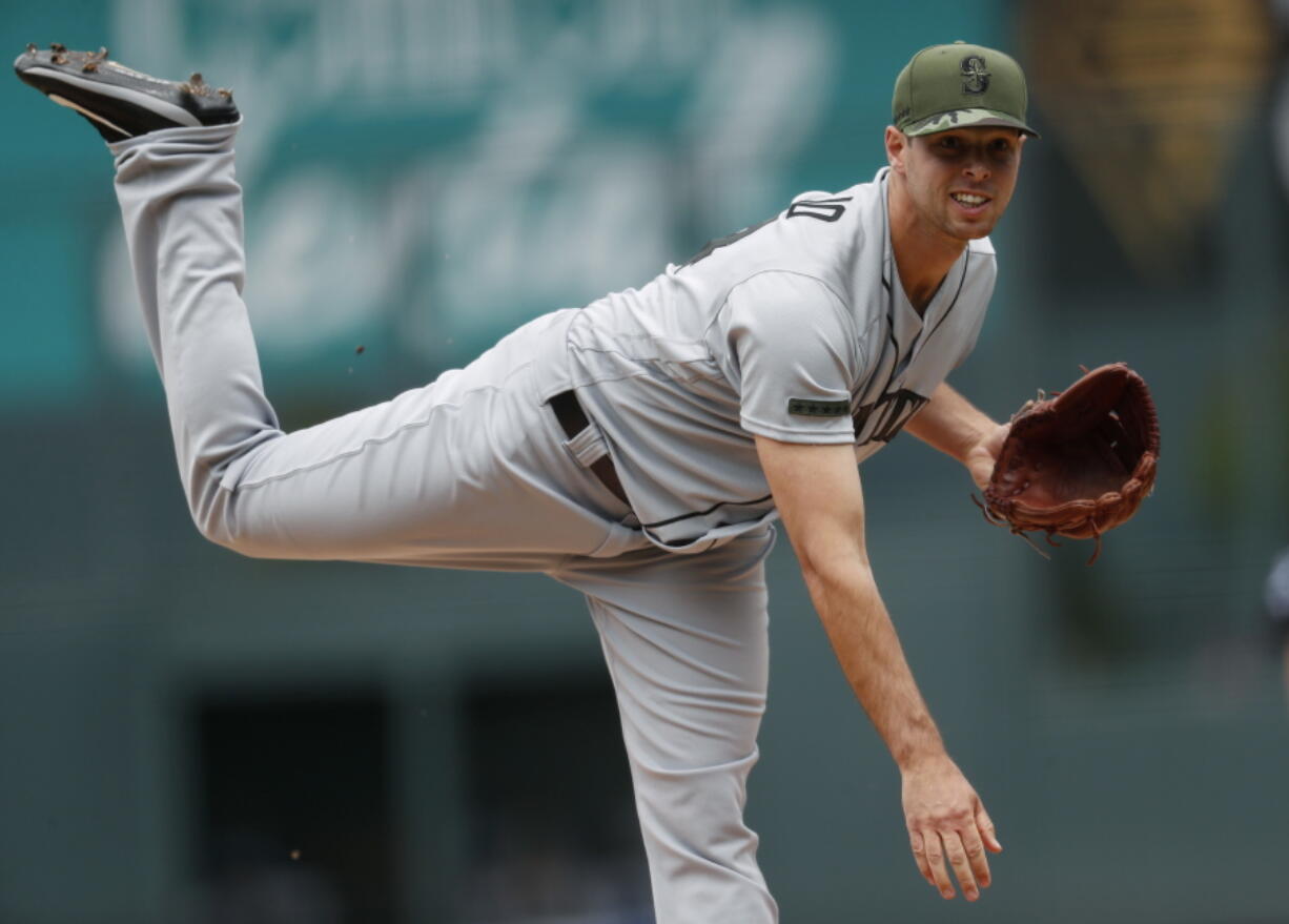 Seattle Mariners starting pitcher Sam Gaviglio delivers to Colorado Rockies' Charlie Blackmon in the first inning of an interleague baseball game Monday, May 29, 2017, in Denver.