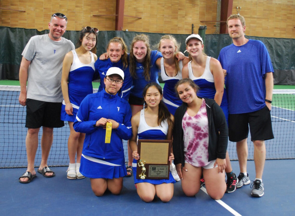 Mountain View girls tennis team with the 3A bi-district title trophy at Sprinker Tennis Center in Spanaway, Saturday, May 20, 2017.