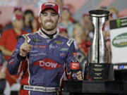 Austin Dillon poses with the trophy after winning the Coca-Cola 600 at Charlotte Motor Speedway.