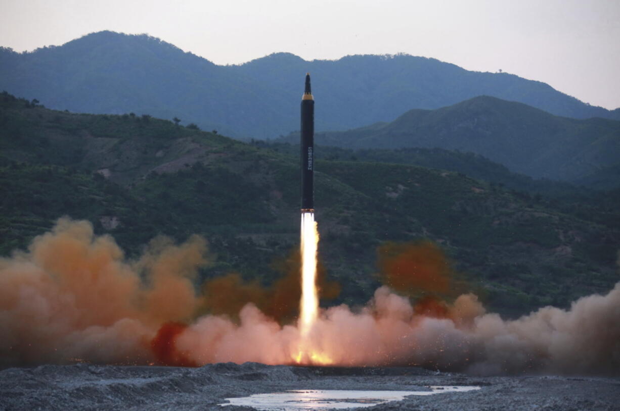 This Sunday photo distributed by the North Korean government shows the “Hwasong-12,” a new type of ballistic missile at an undisclosed location in North Korea. North Korea on Monday boasted of a successful weekend launch of a new type of “medium long-range” ballistic rocket that can carry a nuclear warhead.