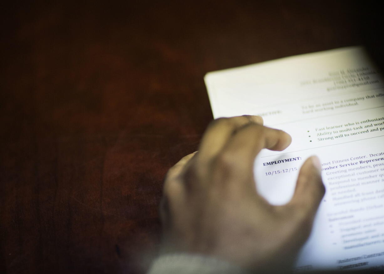 FILE - In this Thursday, March 3, 2016, file photo, a job candidate's resume sits on a table as he interviews for a job during a recruiting event at the Georgia Department of Labor office in Atlanta. One state and at least two cities have passed laws that bar employers from asking applicants about their salary history. Several states have proposed similar legislation in 2017.