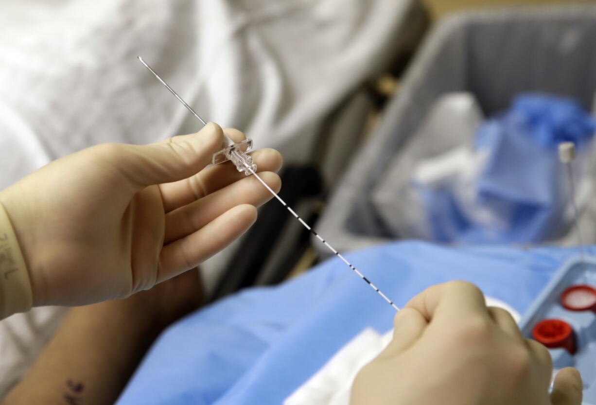 Anesthesiologist Dr. Ron Samet performs an ultrasound-guided nerve block at the University of Maryland Medical Center, preparing a catheter that will deliver a numbing drug to nerves responsible for a patient&#039;s arm pain. Nerve blocks allow many patients to avoid or reduce use of potentially addictive painkillers after surgery, one way hospitals are reducing their own dependence on opioids.