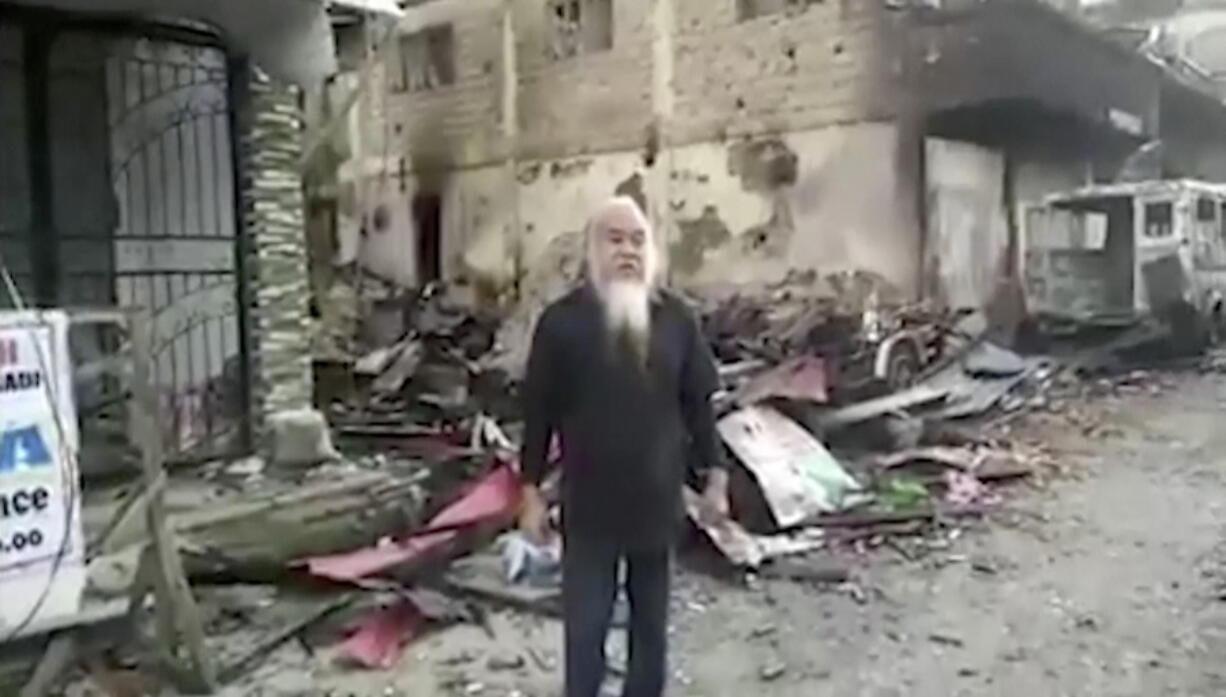 In a video apparently taken under duress, Father Teresito Suganob, a Catholic priest in Marawi, Philippines, who was taken hostage by militants linked to the Islamic State group, said he’s being held alongside 200 other captives, including children.