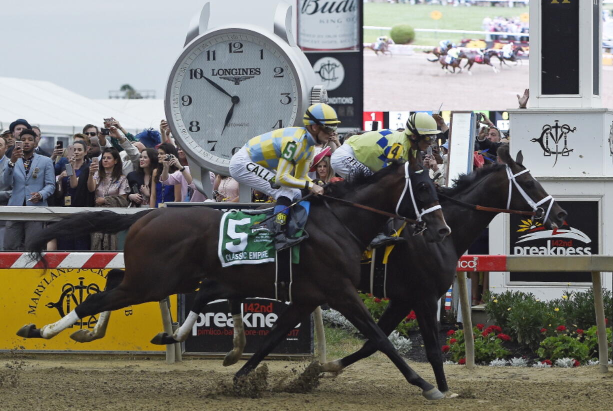 Cloud Computing (2), ridden by Javier Castellano, wins142nd Preakness Stakes horse race at Pimlico race course as Classic Empire with Julien Leparoux aboard takes second, Saturday, May 20, 2017, in Baltimore.