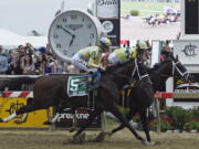 Cloud Computing (2), ridden by Javier Castellano, wins142nd Preakness Stakes horse race at Pimlico race course as Classic Empire with Julien Leparoux aboard takes second, Saturday, May 20, 2017, in Baltimore.