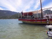 A young boy jumps off a tourist boat into one of the many beaches on Ilha Grande, or Big Island, about three hours from Rio de Janeiro on Feb. 13. About three hours from Rio de Janeiro, the tropical island remains pristine in large because of an unusual history that includes being a pirate refuge, leper colony and site of a major prison. Still, there are worries about the future as its focus goes from fishing to tourism.